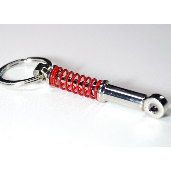 Přívěšek na klíče - tlumič s červenou pružinou